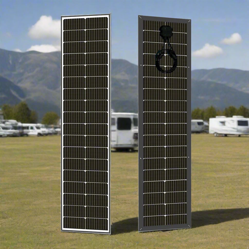 Two solar panels on a grassy field with mountains in the background