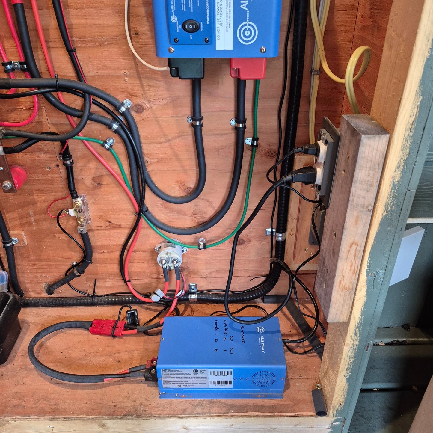 AIMS 75 Amp charge converter installed in wooden cabinet