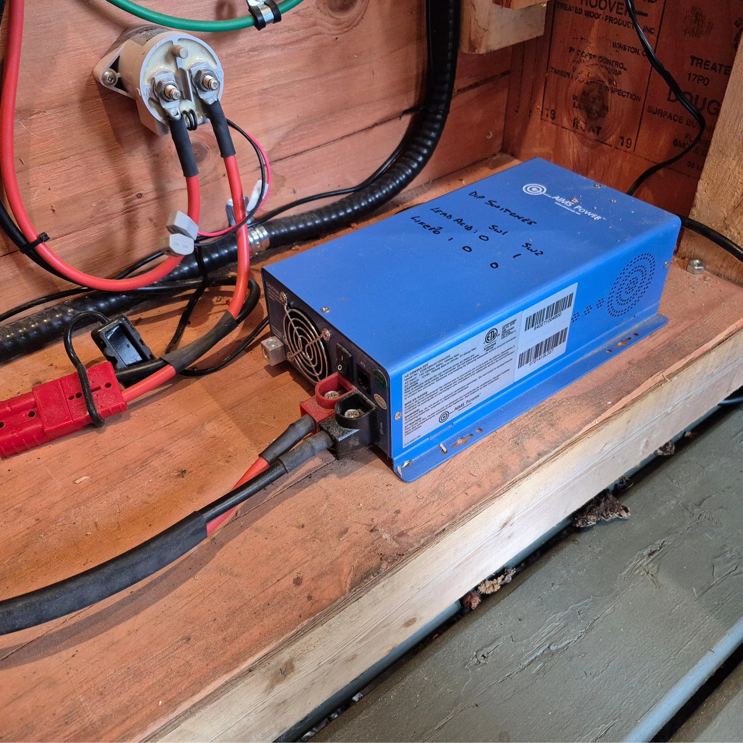 AIMS 75 Amp charge converter installed in wooden cabinet