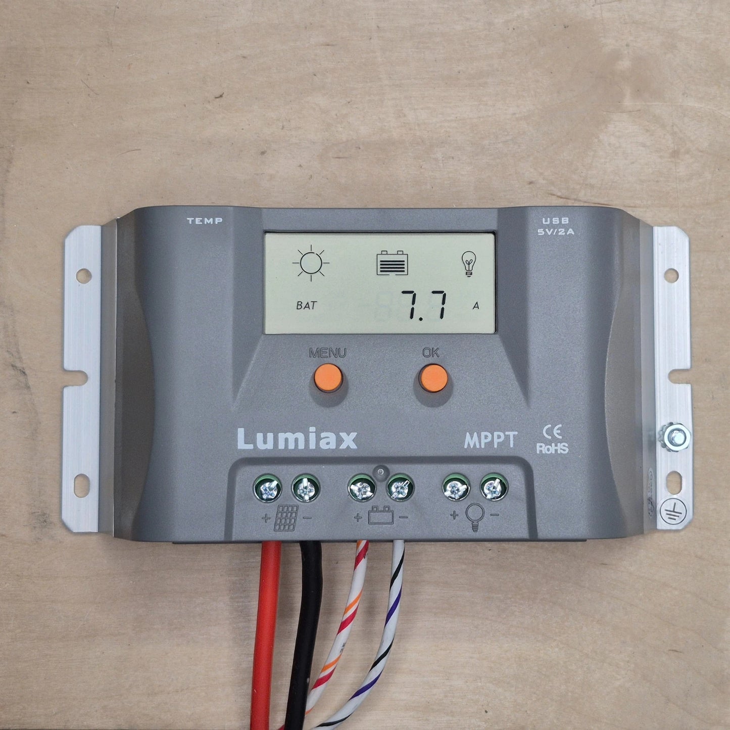 Lumiax 15A solar regulator on a wooden surface