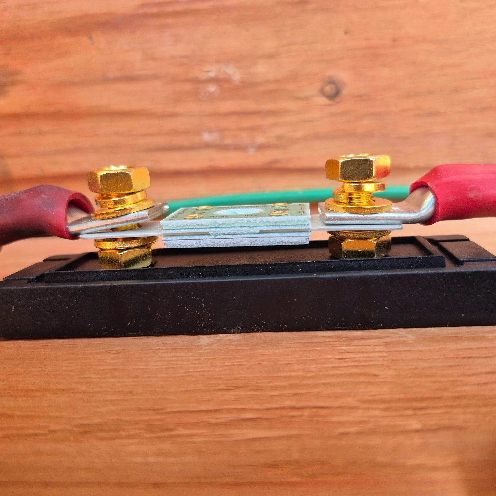 Sapphire Fuse Holder for ANL ADL Fuses, mounted to wooden backing