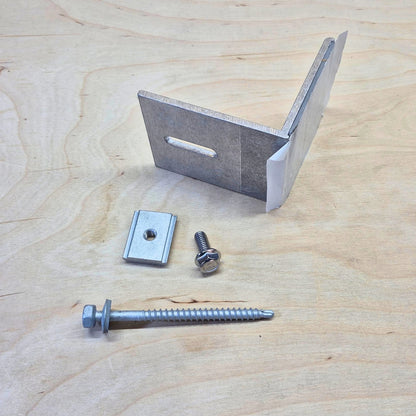 Kinetic Solar Universal L bracket with butyl seal on a wood background.  Shown with included screw and bolt hardware.