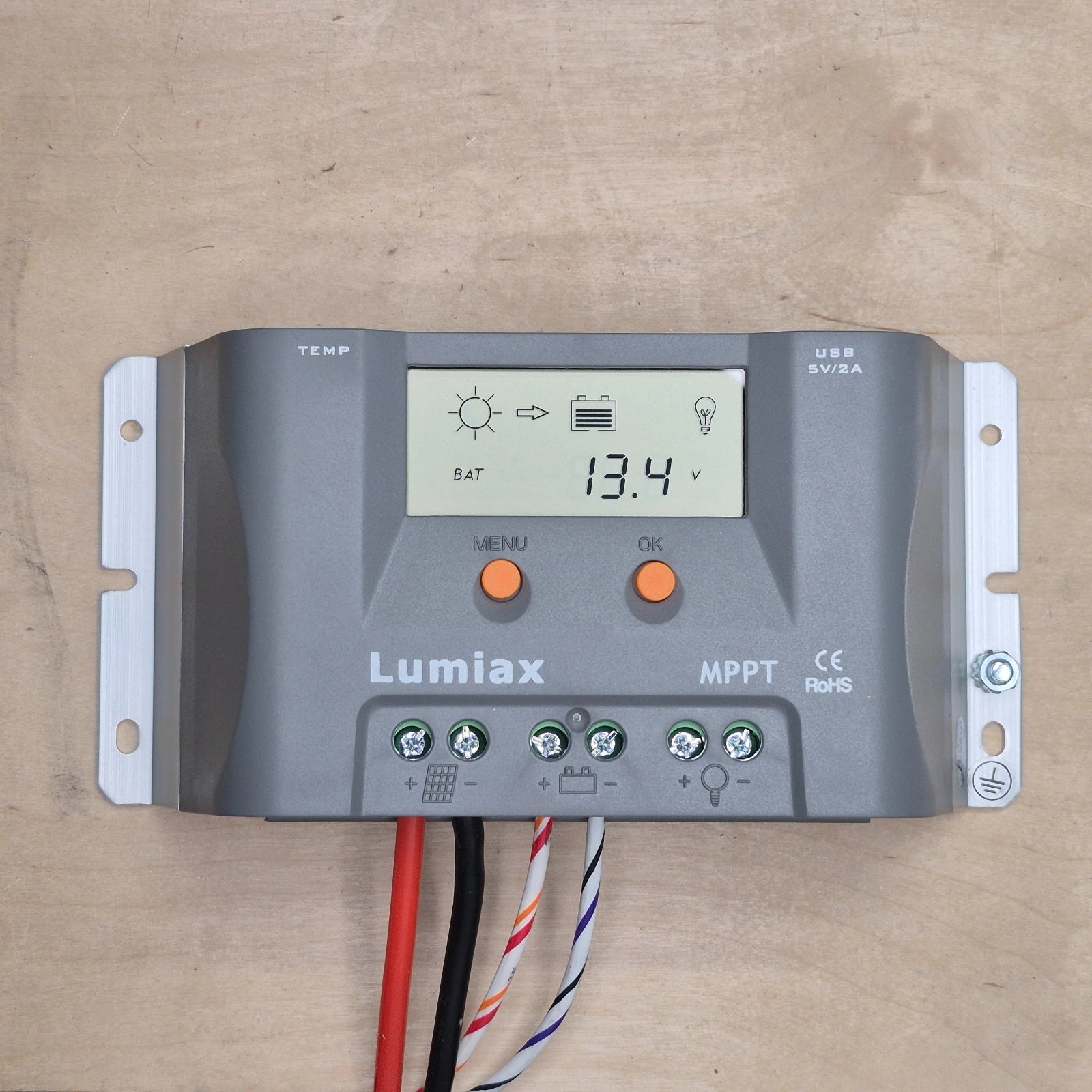 Lumiax 15A solar regulator on a wooden surface