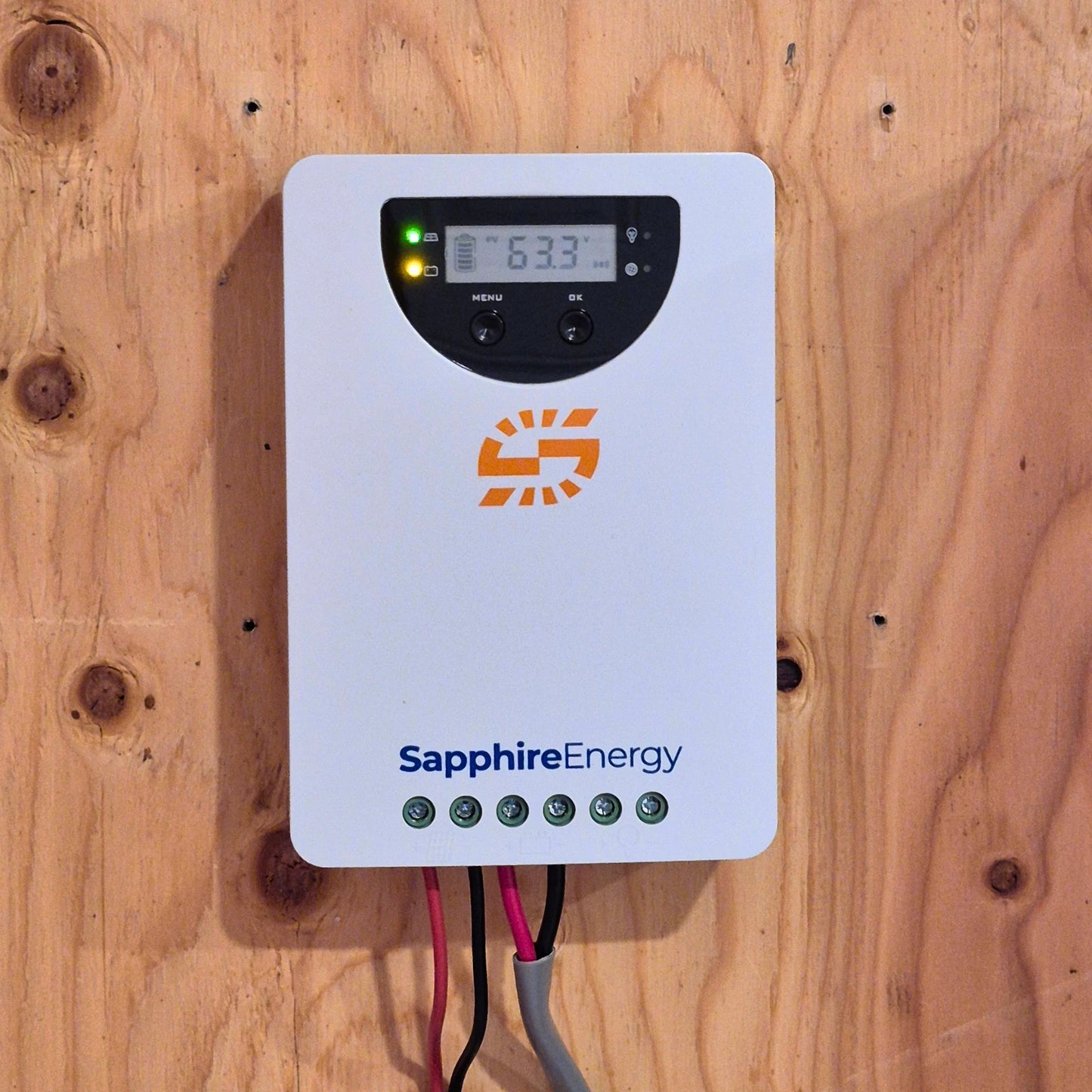 Sapphire Energy solar inverter on a wooden wall